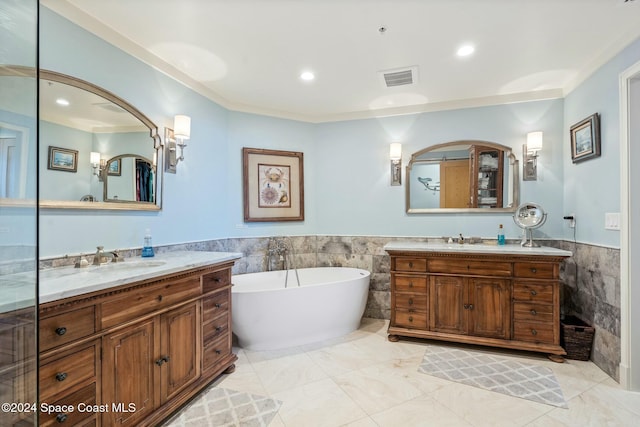 bathroom featuring vanity, tile walls, and a bathing tub