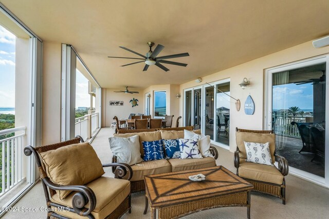 sunroom / solarium with ceiling fan and a healthy amount of sunlight