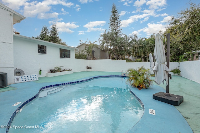 view of pool featuring central AC