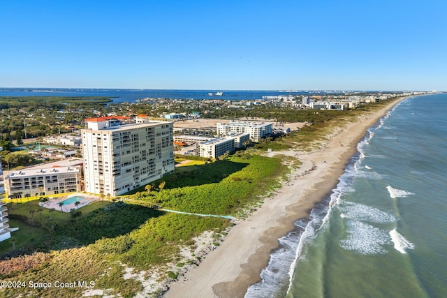 birds eye view of property featuring a view of the beach and a water view