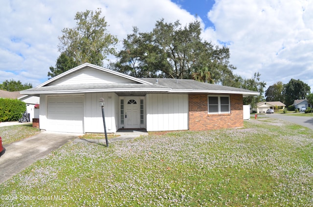 single story home with a garage and a front lawn