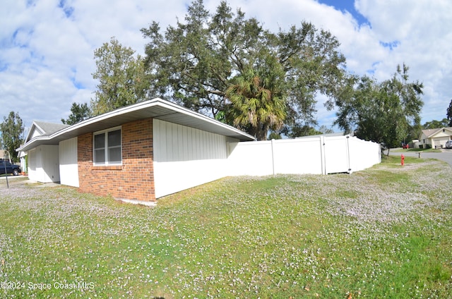 view of home's exterior featuring a yard