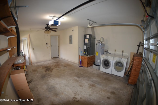 garage with a garage door opener, heating unit, gas water heater, washer and dryer, and electric panel