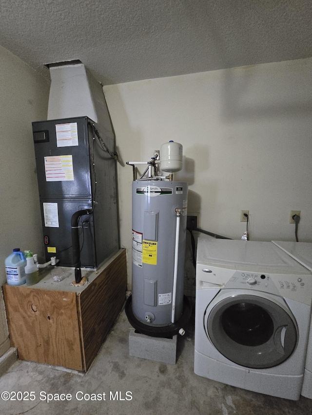 clothes washing area with heating unit, washer / clothes dryer, water heater, and a textured ceiling