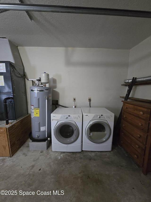 laundry area with separate washer and dryer, heating unit, water heater, and a textured ceiling