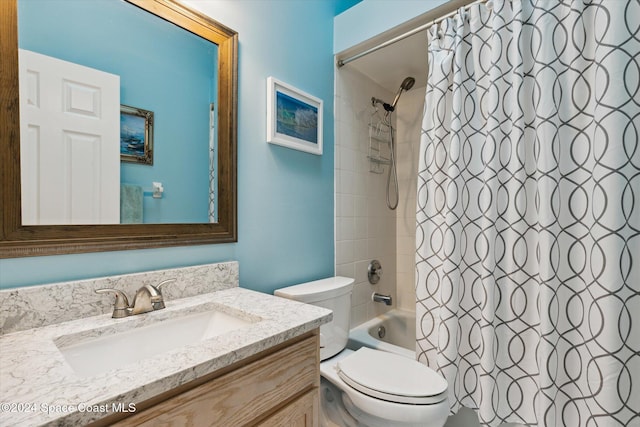 full bathroom with shower / tub combo, vanity, and toilet