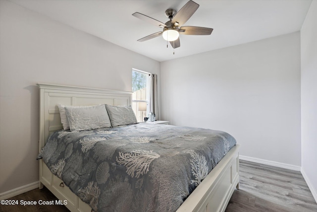 bedroom featuring ceiling fan and wood-type flooring