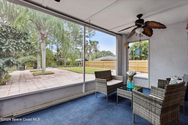 sunroom / solarium with ceiling fan