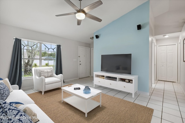 tiled living room featuring ceiling fan