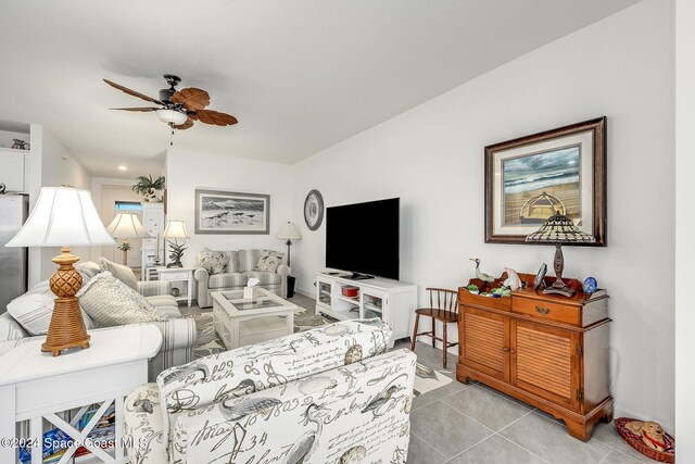 living room with ceiling fan and light tile patterned floors