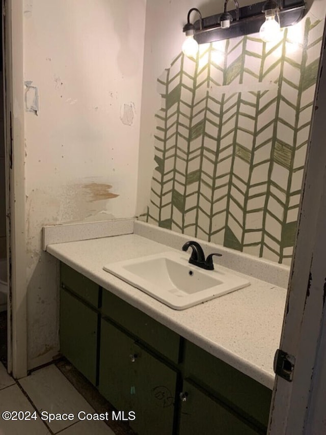 bathroom with tile patterned floors and vanity