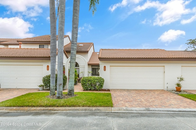 mediterranean / spanish-style house featuring a garage