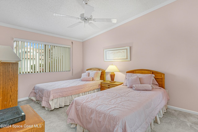 carpeted bedroom featuring ceiling fan, crown molding, lofted ceiling, and a textured ceiling