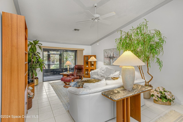 living room with ornamental molding, a textured ceiling, ceiling fan, light tile patterned floors, and lofted ceiling