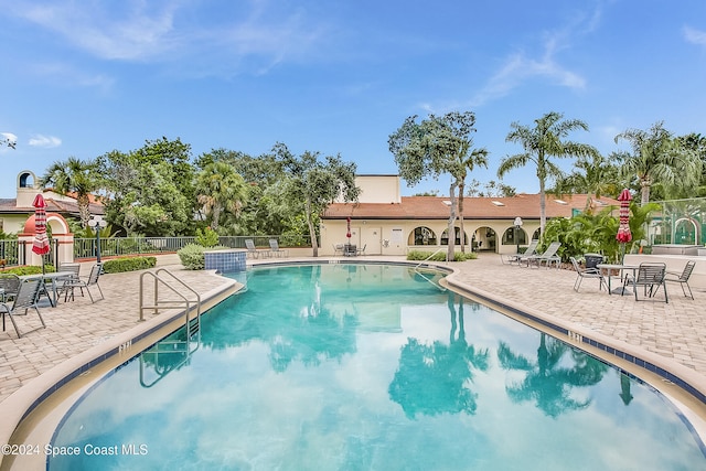 view of pool featuring a patio