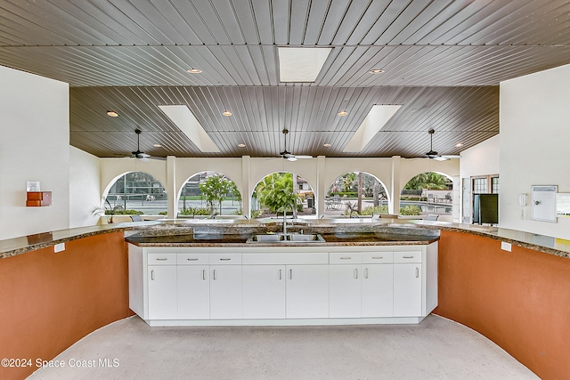 view of patio with an outdoor kitchen and sink