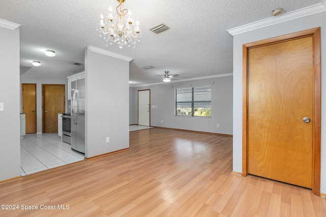 interior space with a textured ceiling, light hardwood / wood-style flooring, and crown molding