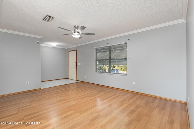 unfurnished room with a textured ceiling, ceiling fan, light wood-type flooring, and ornamental molding