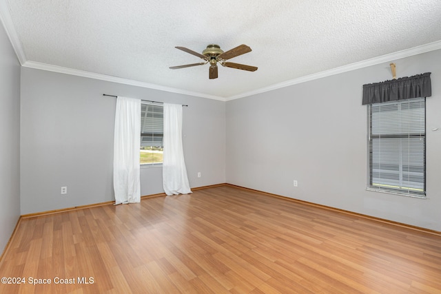 spare room with crown molding, ceiling fan, a textured ceiling, and light wood-type flooring