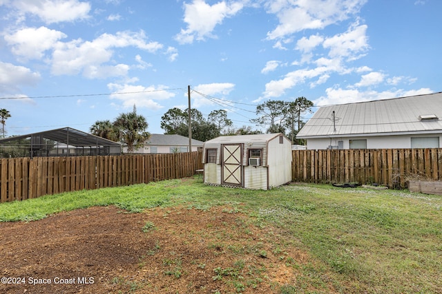 view of yard with a storage shed