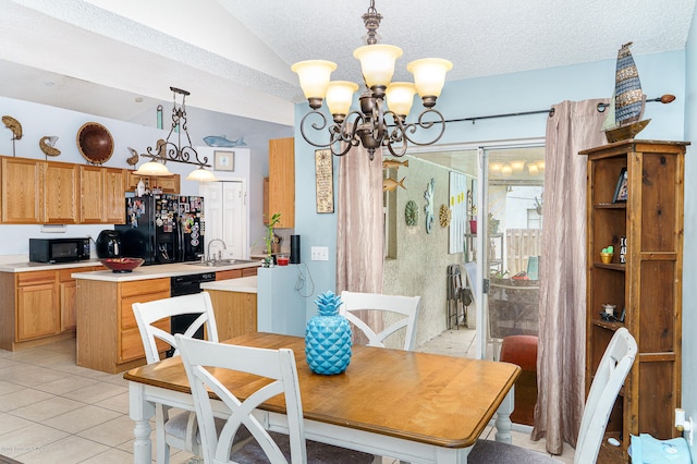 tiled dining area with sink, lofted ceiling, a textured ceiling, and an inviting chandelier