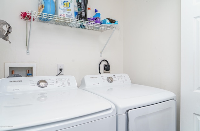 washroom featuring independent washer and dryer