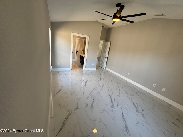 interior space featuring ceiling fan and lofted ceiling