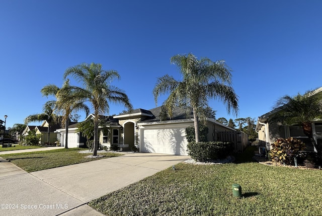 view of front facade featuring a garage and a front lawn