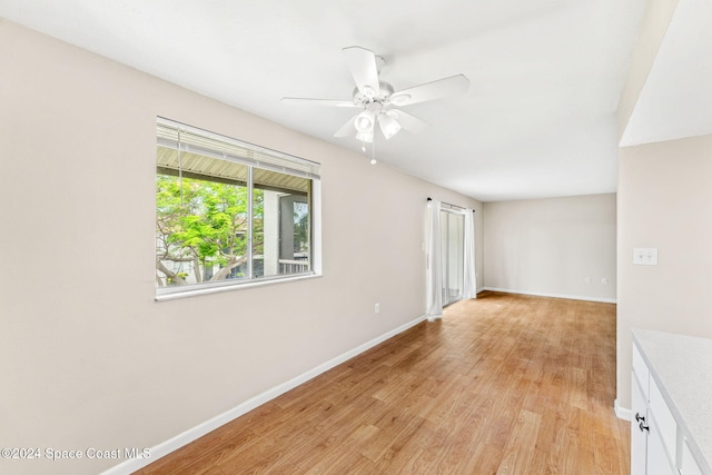 unfurnished room featuring ceiling fan and light hardwood / wood-style floors