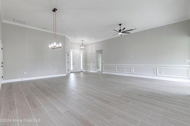 unfurnished living room with light hardwood / wood-style floors, ceiling fan with notable chandelier, and ornamental molding