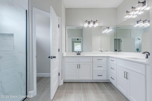 bathroom featuring vanity and an enclosed shower