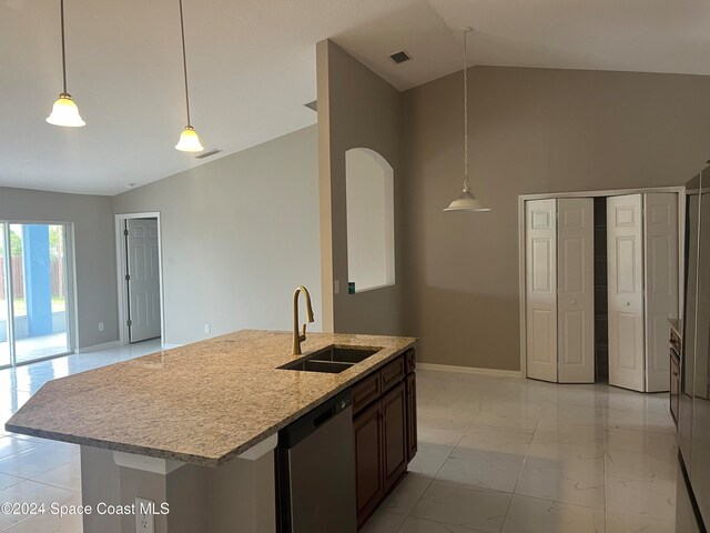 kitchen featuring vaulted ceiling, decorative light fixtures, stainless steel dishwasher, and sink