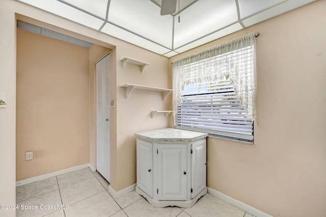 washroom with light tile patterned flooring