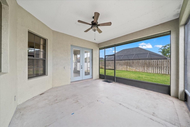 unfurnished sunroom with french doors and ceiling fan