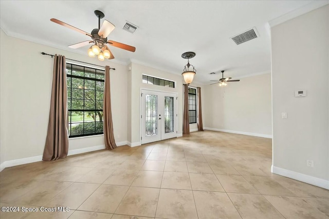 empty room with ceiling fan, ornamental molding, light tile patterned floors, and french doors