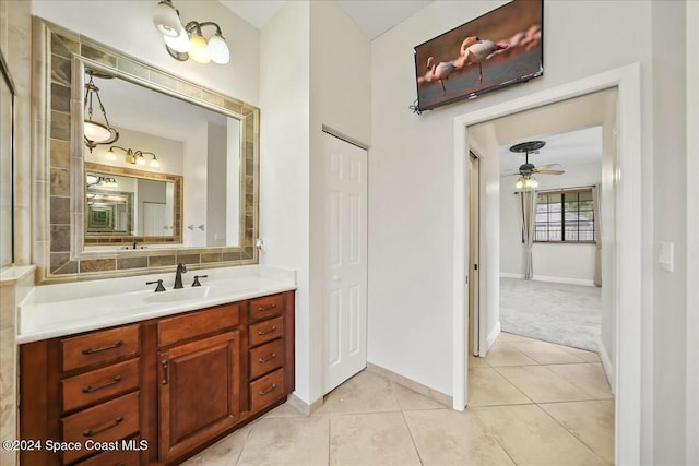 bathroom featuring ceiling fan, tile patterned flooring, and vanity