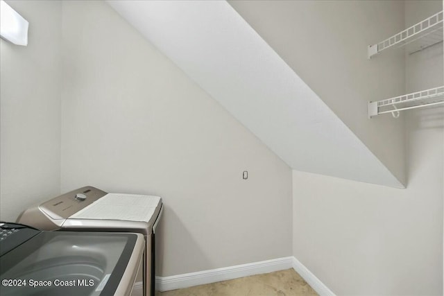 laundry room featuring washing machine and clothes dryer