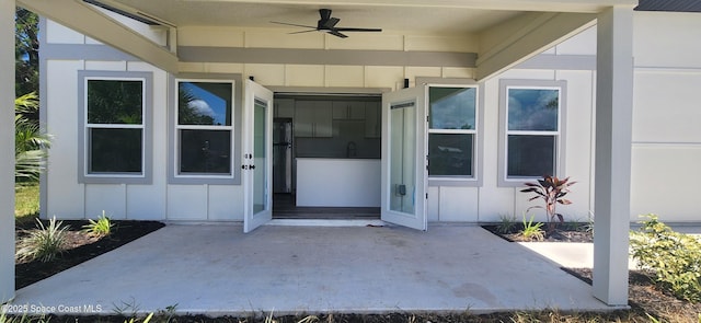 205 Flamingo Dr, Cocoa, FL 32926 - property entrance with board and batten siding and a ceiling fan