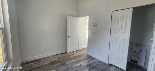 205 Flamingo Dr, Cocoa, FL 32926 - unfurnished bedroom with a closet and dark wood-style flooring