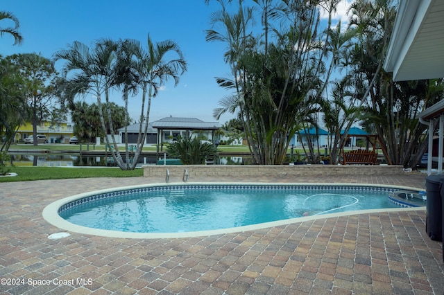491 Indian Creek Dr, Cocoa Beach, FL 32931 - swimming pool featuring a patio area