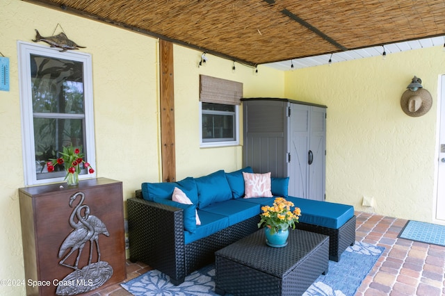 491 Indian Creek Dr, Cocoa Beach, FL 32931 - view of patio featuring an outdoor hangout area