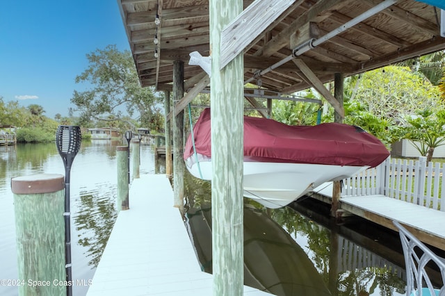 491 Indian Creek Dr, Cocoa Beach, FL 32931 - dock area with a water view and boat lift