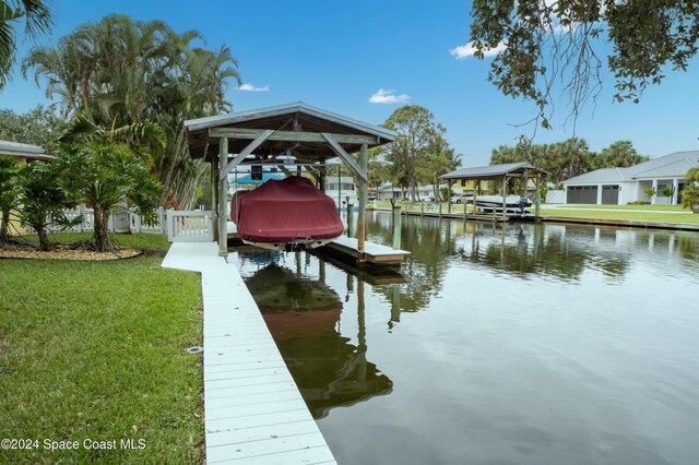 491 Indian Creek Dr, Cocoa Beach, FL 32931 - dock with boat lift and a water view