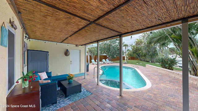 491 Indian Creek Dr, Cocoa Beach, FL 32931 - outdoor pool featuring a patio area, an outdoor living space, and a fenced backyard
