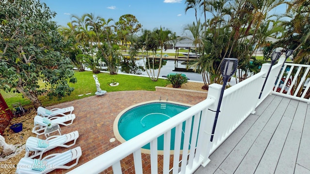 491 Indian Creek Dr, Cocoa Beach, FL 32931 - view of swimming pool featuring a water view and a yard