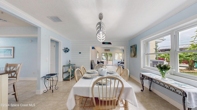 491 Indian Creek Dr, Cocoa Beach, FL 32931 - dining room featuring light tile patterned floors and baseboards
