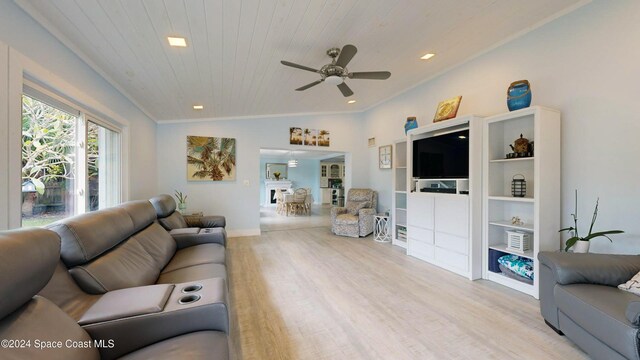 491 Indian Creek Dr, Cocoa Beach, FL 32931 - living area with a ceiling fan, light wood-type flooring, crown molding, wooden ceiling, and vaulted ceiling