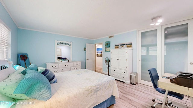 491 Indian Creek Dr, Cocoa Beach, FL 32931 - bedroom featuring light wood-type flooring, crown molding, and baseboards