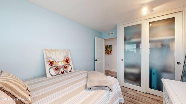 491 Indian Creek Dr, Cocoa Beach, FL 32931 - bedroom featuring light wood-style flooring