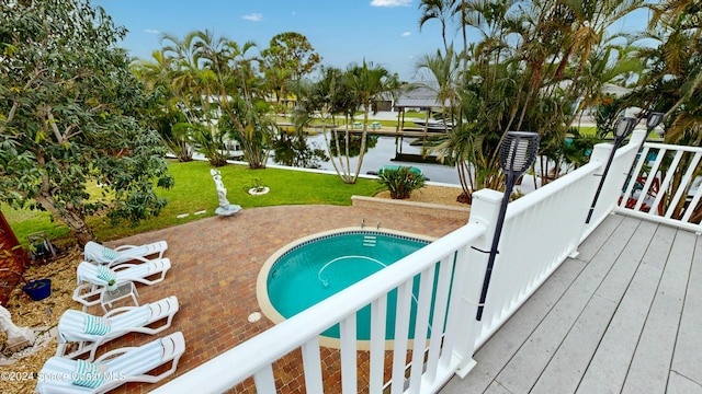 491 Indian Creek Dr, Cocoa Beach, FL 32931 - view of pool with a water view and a lawn